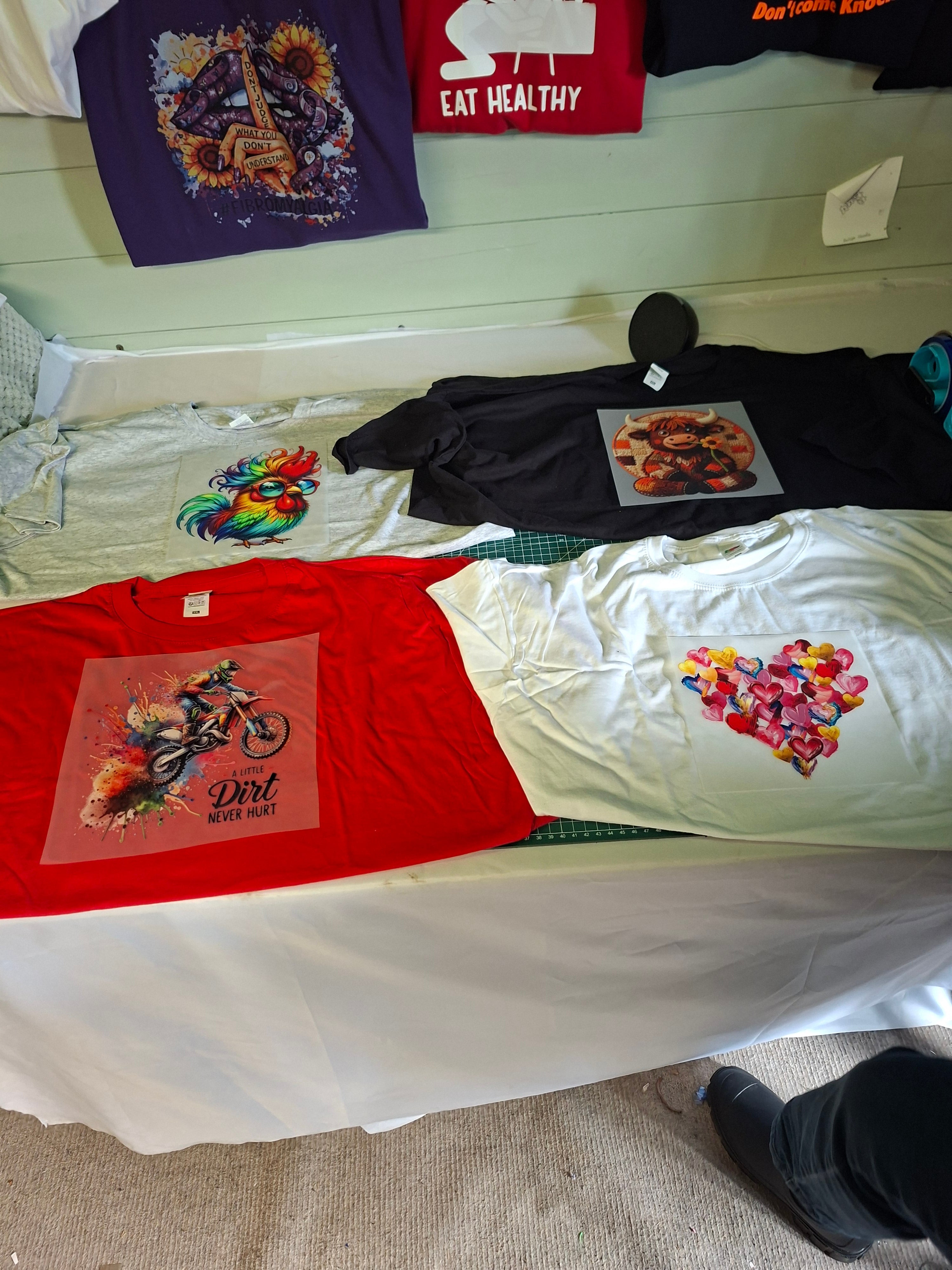 DTFs available to be printed on T Shirts, Hoodies, Jumpers And polo Shirts